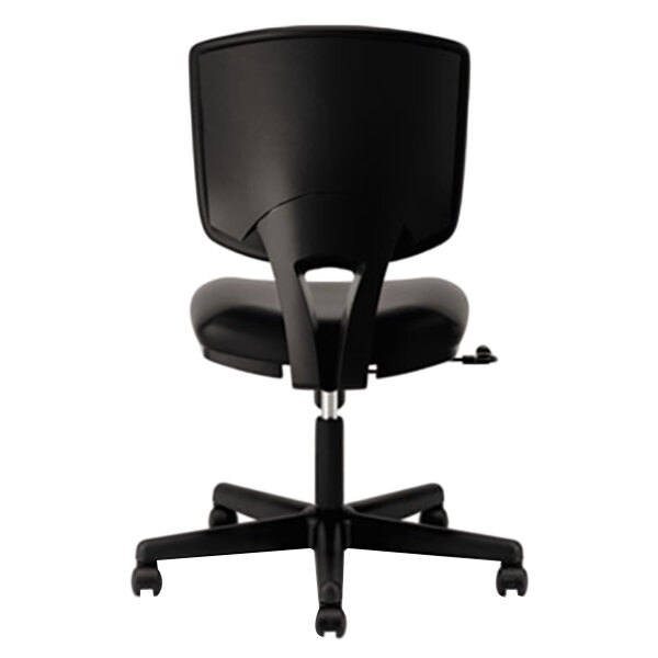 A close up of a black HON Volt leather office chair with wheels.