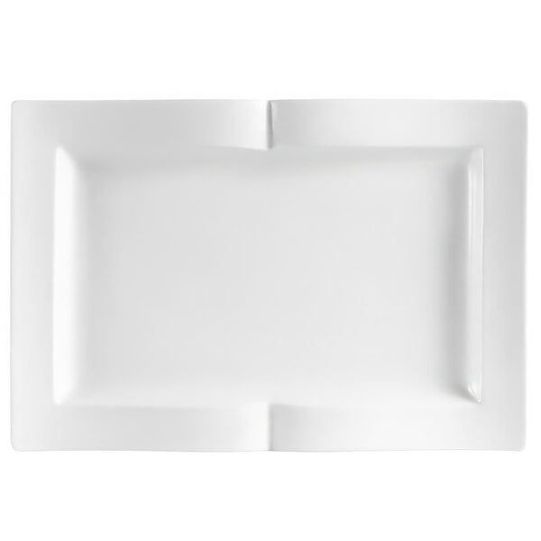 A white rectangular china platter with curved edges and a small cut out.