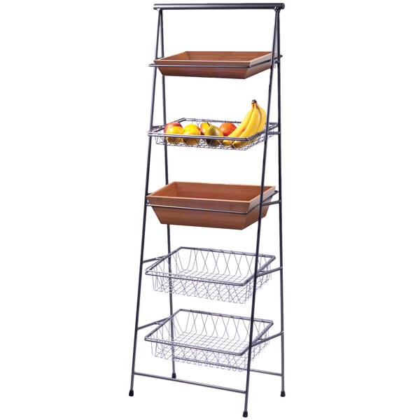 A rectangular bamboo tray on a metal shelf with food in it.