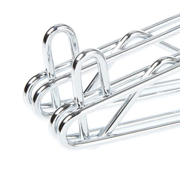 A pair of chrome metal brackets.