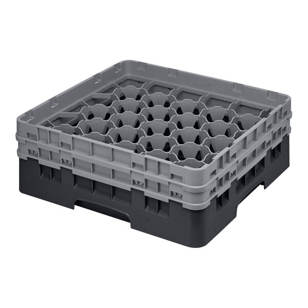 A black plastic Cambro glass rack with extenders.