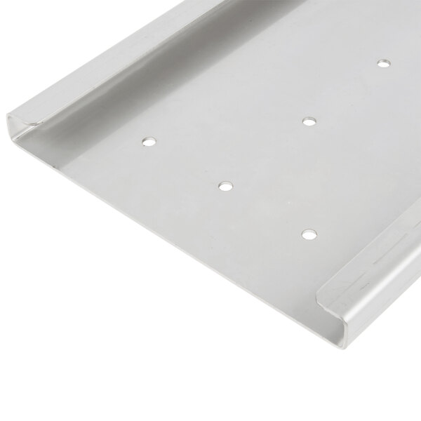A white metal Vollrath wall mount bracket with holes in it.