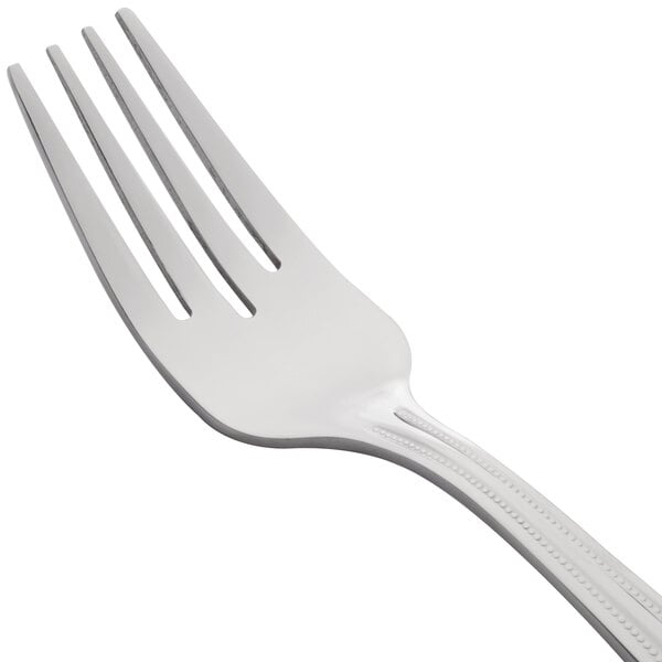 A 10 Strawberry Street stainless steel salad fork with a white handle.