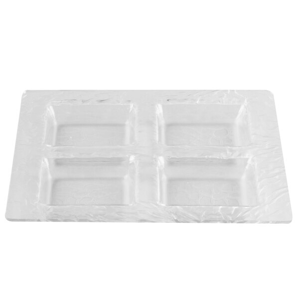 A white rectangular Clipper Mill by GET clear plastic tray with four rectangular compartments.