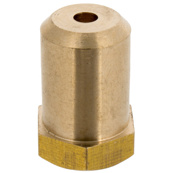 A gold metal Cooking Performance Group natural gas orifice with a hole in the middle.