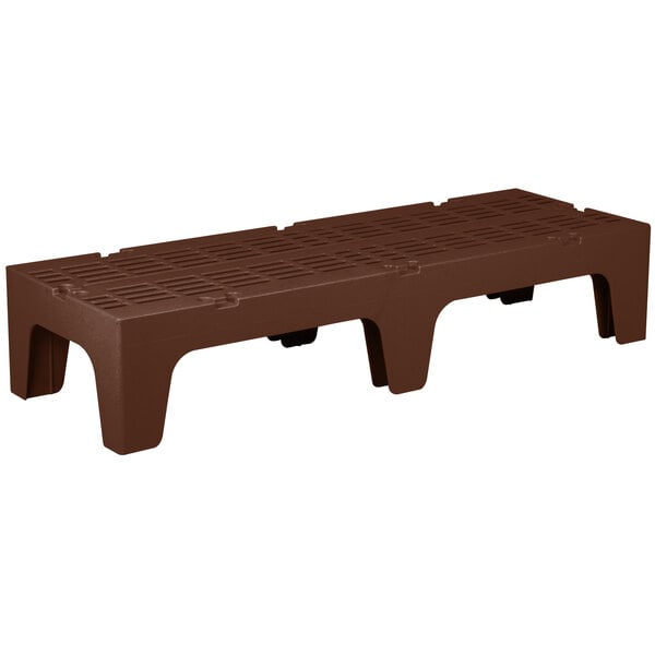 A brown plastic Cambro bow tie dunnage rack with slotted top.