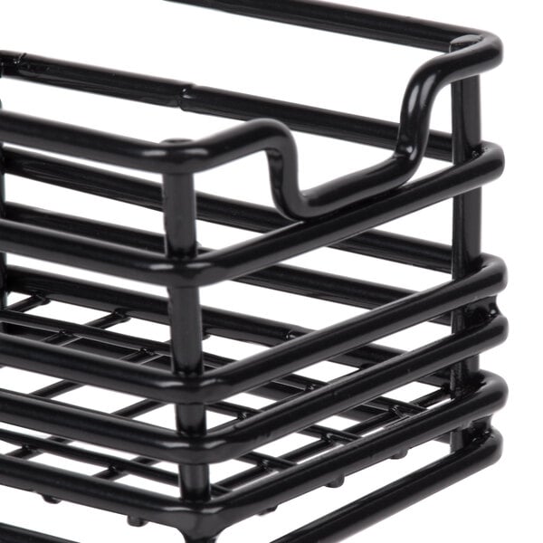 A black Clipper Mill by GET Teflon-coated iron sugar caddy with handles.