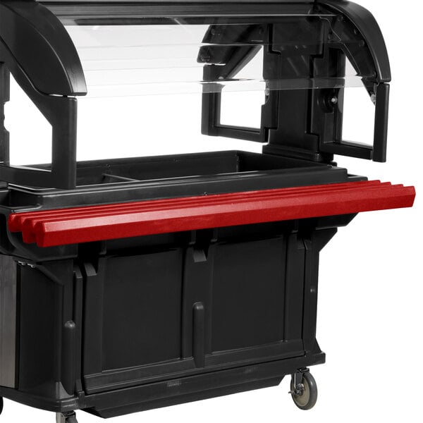 A red Cambro tray rail on a black and red food cart.