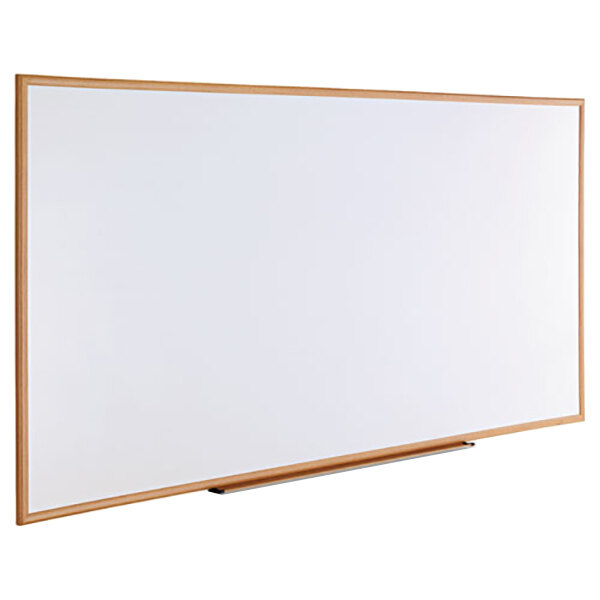 A Universal white melamine dry-erase board with an oak frame.