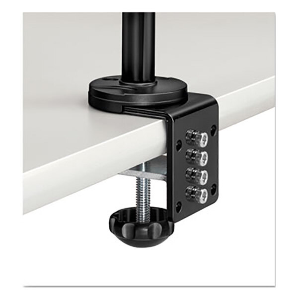 A black metal Fellowes dual monitor arm attached to a white table surface with a screw.