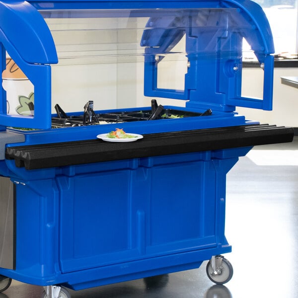 A black Cambro tray rail on a blue food buffet cart.