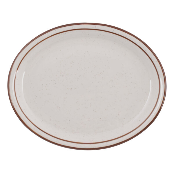 A white narrow rim china platter with brown speckles on the rim.