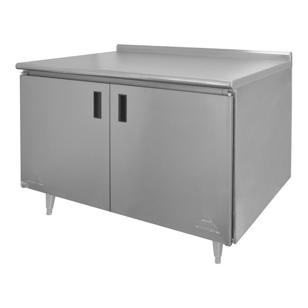 A stainless steel Advance Tabco work table with enclosed base and midshelf.