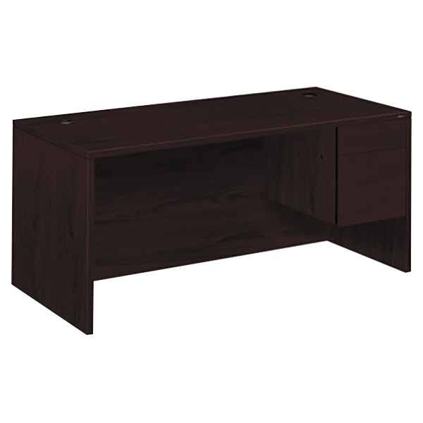 A mahogany HON pedestal desk with a drawer.