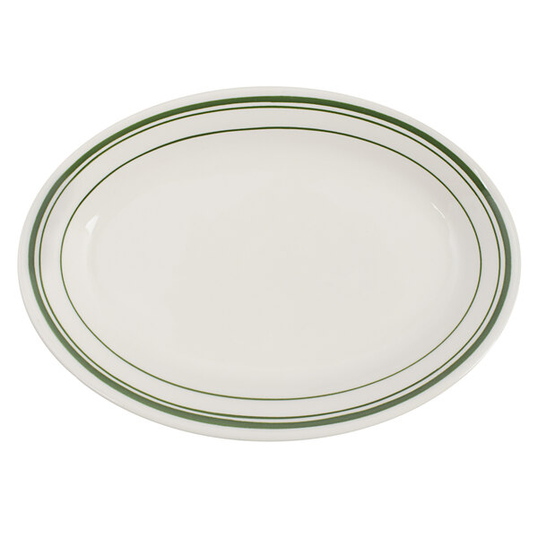 A white oval Tuxton china platter with green bands.