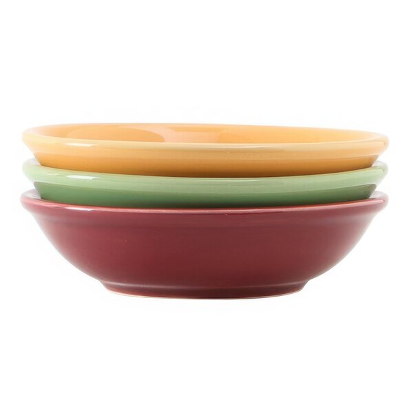 A stack of Tuxton sauce dishes in assorted colors on a white background.