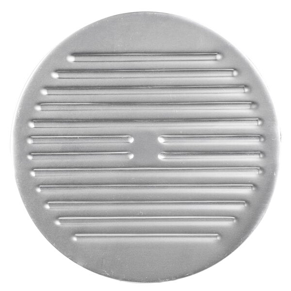 A circular metal Avantco Slicer blade cover with lines.