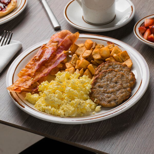 A Tuxton Bahamas brown speckle narrow rim china plate with breakfast food on it.
