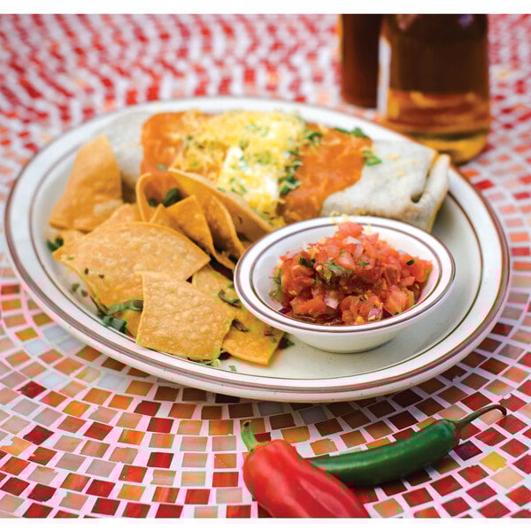 A Tuxton brown speckle narrow rim china platter with a plate of food and a bowl of salsa.