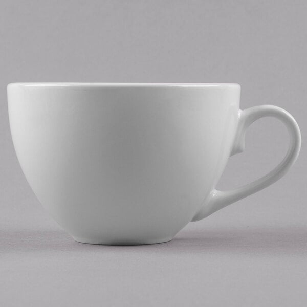 A Libbey bright white porcelain low coffee cup with a handle.