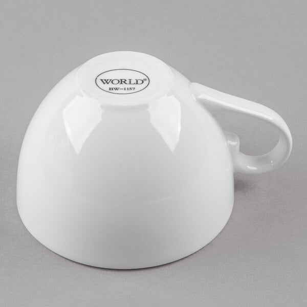 A Libbey bright white porcelain low cup with a handle.