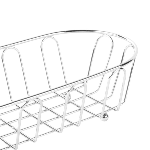 A Clipper Mill chrome metal long oval wire basket with a curved edge and a handle.