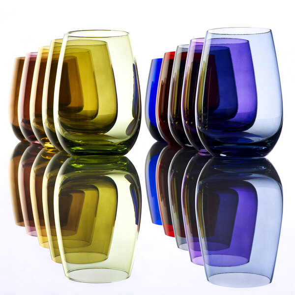 A row of Stolzle smoky grey stemless wine glasses on a table.