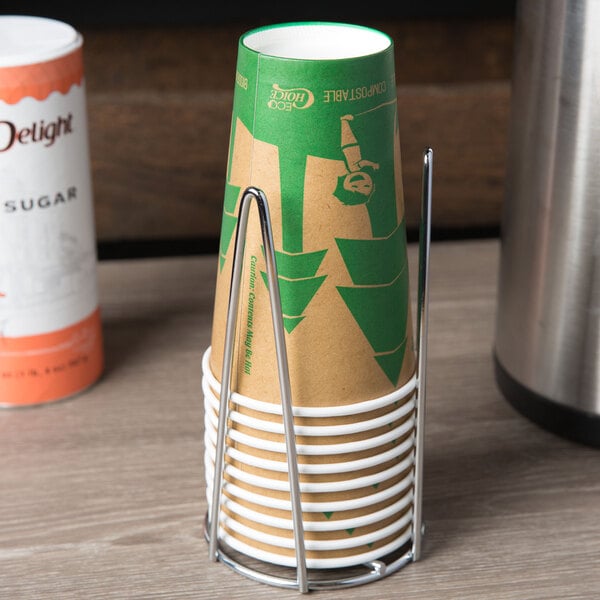 A Clipper Mill chrome plated single countertop cup holder holding a paper cup on a table.