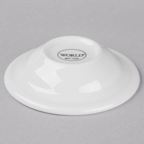 A white Libbey porcelain fruit bowl with a black rim.