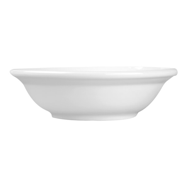 A plain white porcelain grapefruit bowl with a simple, rounded design.
