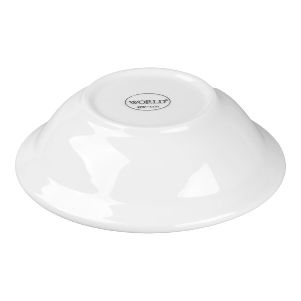 A white porcelain grapefruit bowl shown upside down.