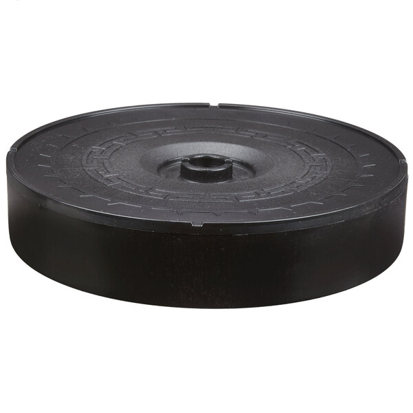 A black round Carlisle microwaveable plastic tortilla server with a circular design.