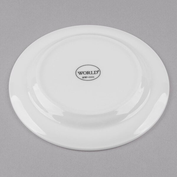 A white Libbey medium rim porcelain plate with a black logo.