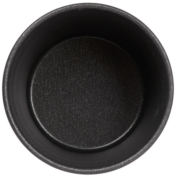 A black round Matfer Bourgeat non-stick mold.