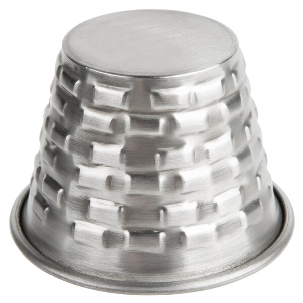 A Tablecraft stainless steel round sauce cup with a round base.