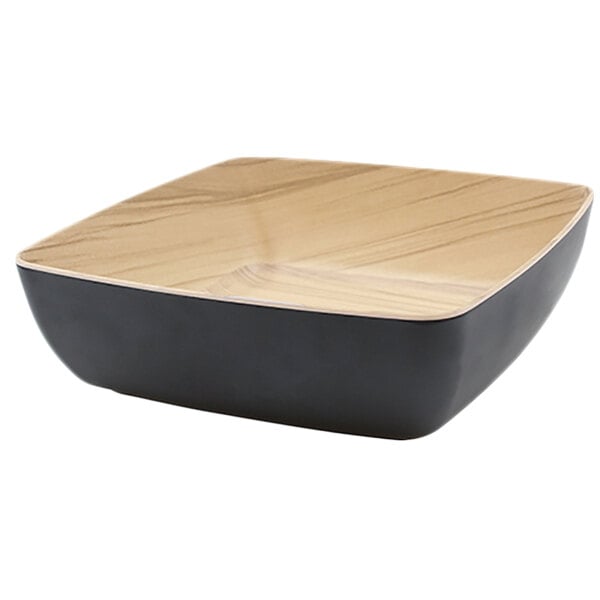 A black square melamine bowl with a bamboo edge.