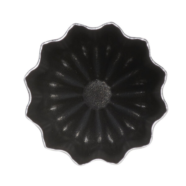 A black and silver Matfer Bourgeat aluminum cannele mold.