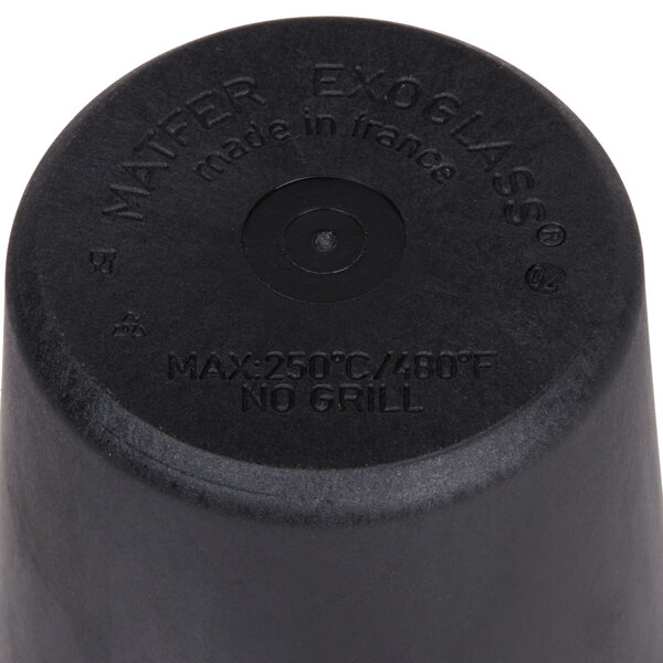 A black cylinder with the words "Rum Baba / Dariole Mold" on it.
