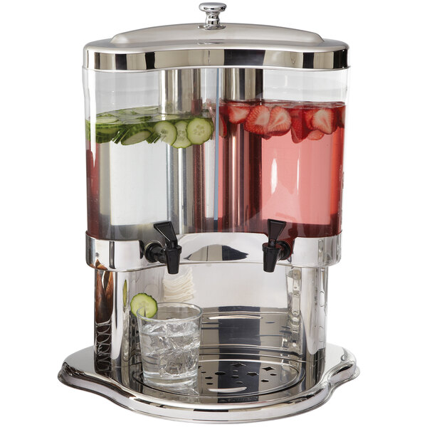 An American Metalcraft beverage server with two drinks and fruit and vegetables inside.