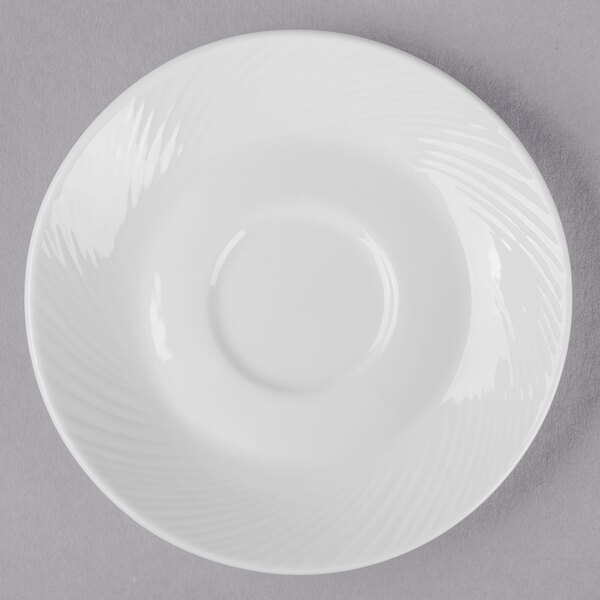 A white Libbey porcelain saucer with a circle on the rim.