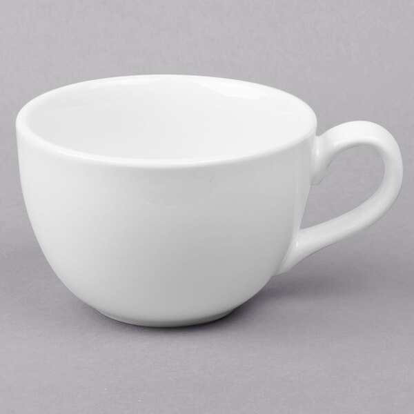 A Libbey bright white porcelain low cup with a handle.