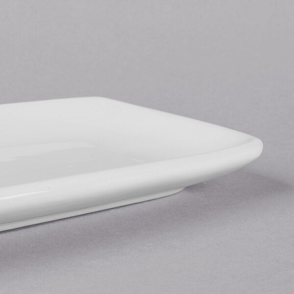 A close-up of a Libbey Bright White rectangular porcelain tray.