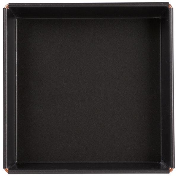 A black square Matfer Bourgeat cake pan with a steel edge.