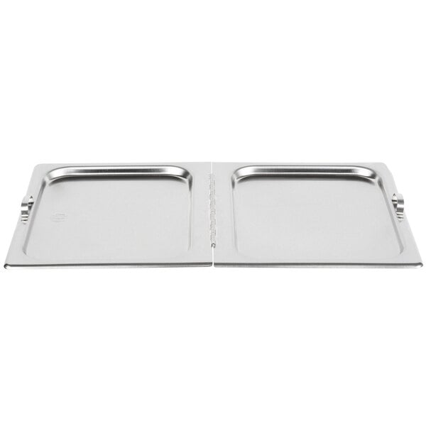 A Vollrath stainless steel hinged flat hotel pan cover on a metal tray on a counter.