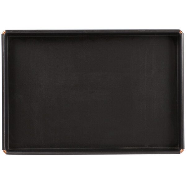 A black rectangular cake pan with a white border.