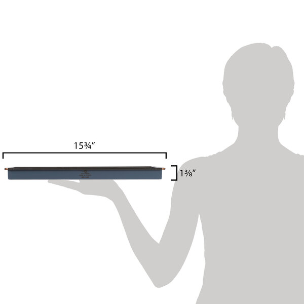 A woman holding a Matfer Bourgeat rectangular cake pan with measurements.