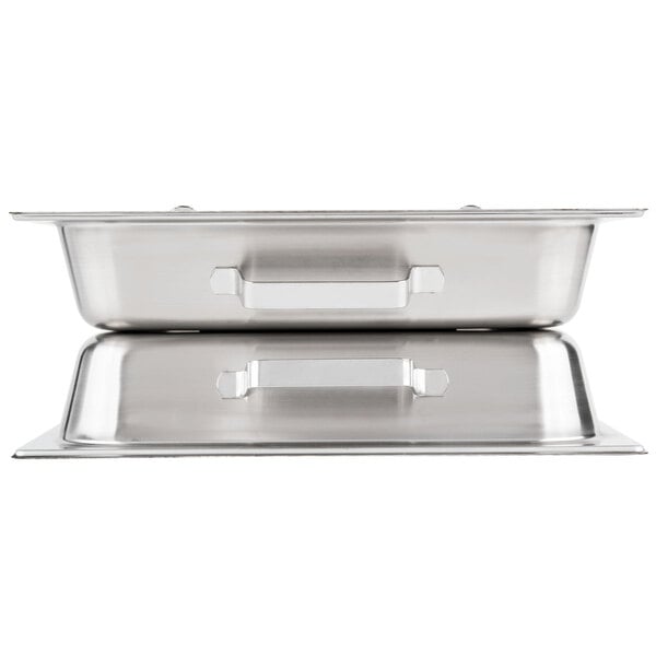 A close-up of a Vollrath stainless steel hinged dome cover on a tray.