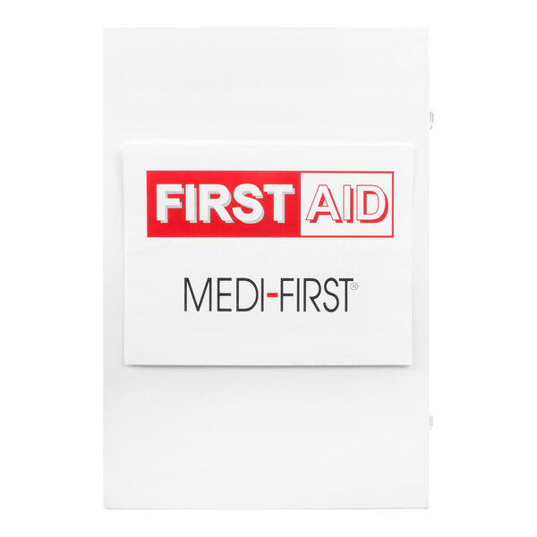 A white Medi-First first aid kit cabinet with a labeled front panel.