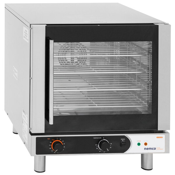 A Nemco countertop convection oven with a glass door.