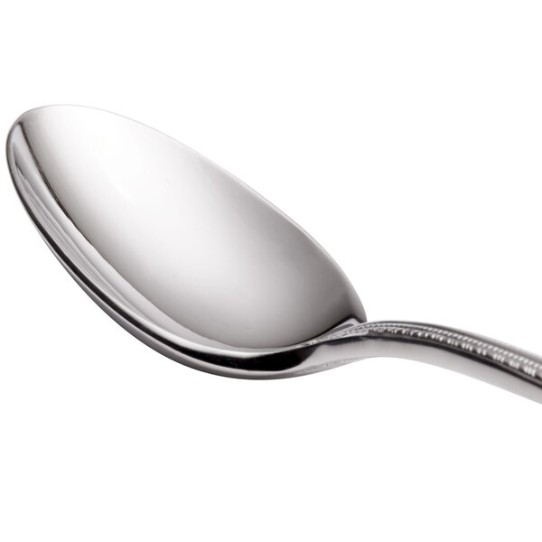 A Reed & Barton stainless steel spoon with a silver handle and spoon.